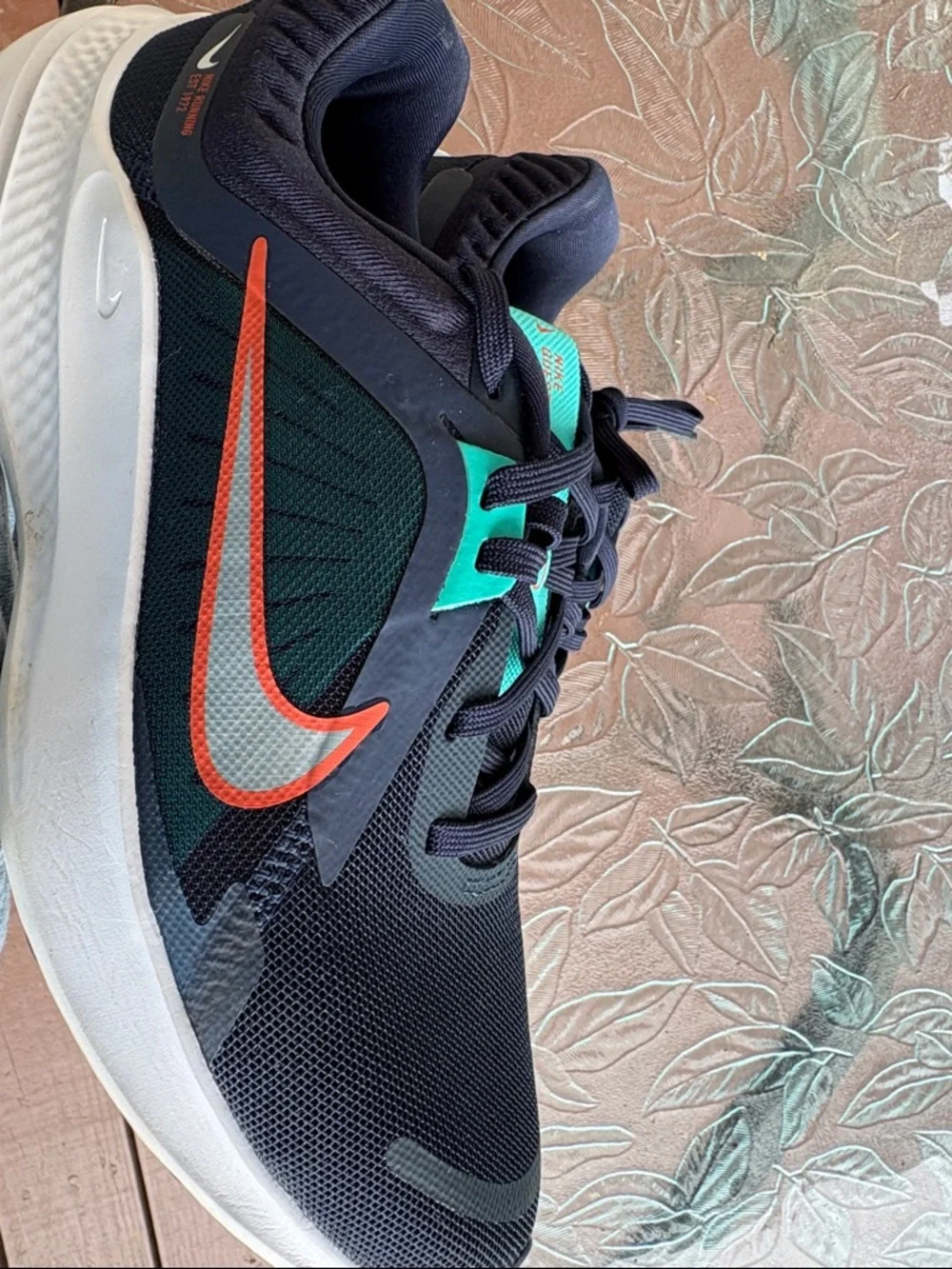 Nike Stylish Navy and Teal Women’s Running Sneakers with Orange Swoosh